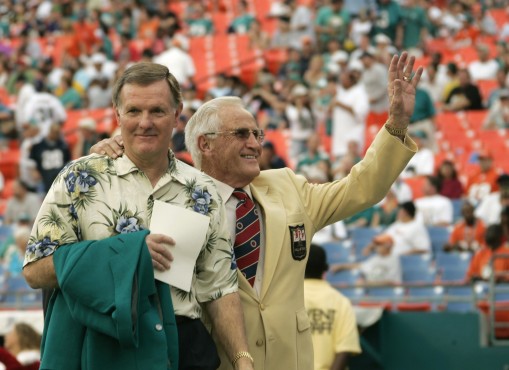 Former Miami Dolphins Bob Griese, left, and coach Don Shula wave to the crowd in this Dec. 16, 2007 file photo, in Miami, as the two celebrated the 35th anniversary of the 1972 undefeated football team. (AP Photo/J. Pat Carter)